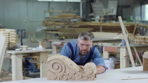 Carpenter Working in Carpentry Shop