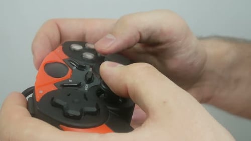 Hands Playing a Video Game with Controller