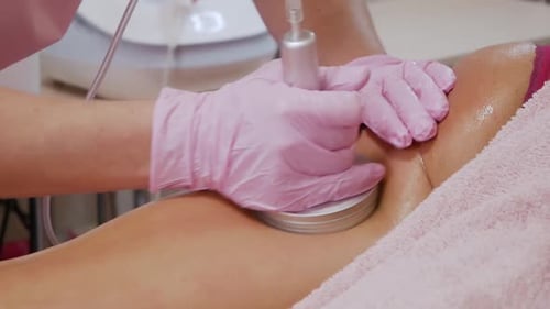 Massage Device Used On Person's Leg