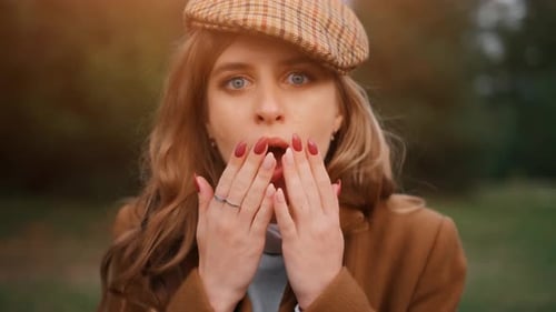 The Shocked Young Pretty Woman in a Forest