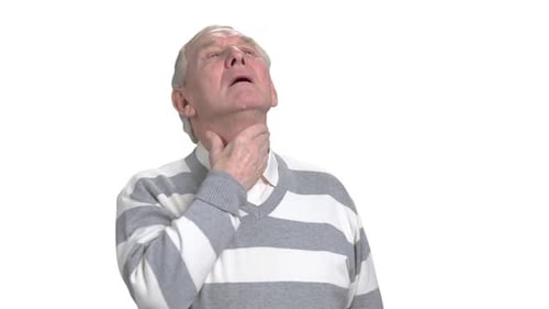Older man holds his throat