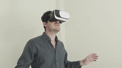 Man Experiencing Virtual Reality with VR Headset