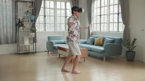 Man Enjoys Virtual Reality at Home