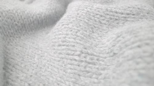 Extreme Detail View of Sheep Wool Cloth Texture Flowing in Macro Dolly Shot