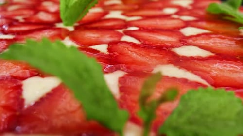 Close Up of Colorful Strawberry Cake with Mint