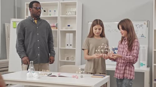 Students Learn About Chemistry With Teacher in Classroom