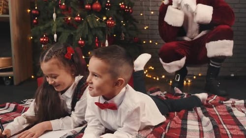 Children Writing Christmas Letters with Santa Claus