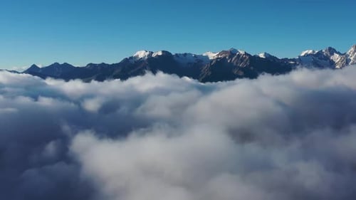 Aerial View of Clouds and Mountains at Sunrise