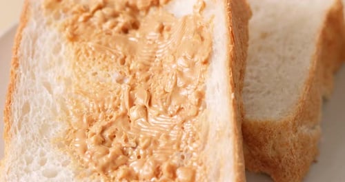 Close Up of Peanut Butter on White Bread
