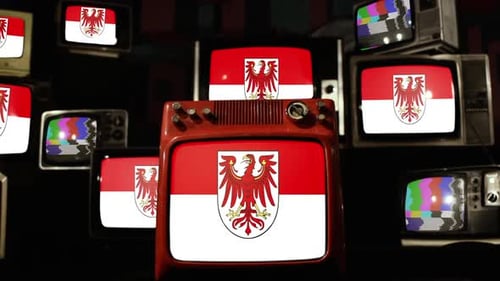 Vintage Televisions Displaying Static and Country Flag