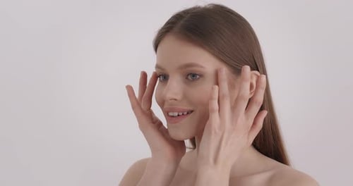 Woman Touches Face in Beauty Close Up Shot