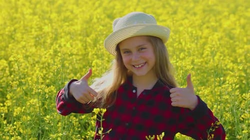 Girl Gives Thumbs Up in a Flower Field