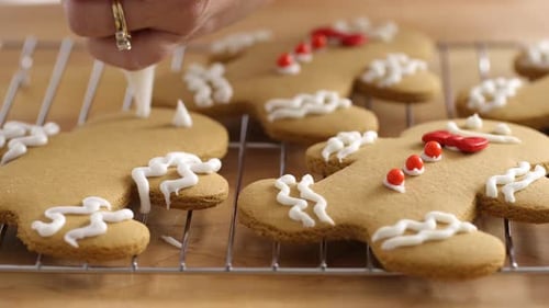 Decorating Gingerbread Man Cookies With Icing Close Up