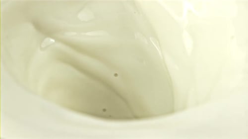 A Whirlpool of Fresh Milk with Air Bubbles