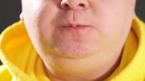 Adult Eating a Hamburger in Close Up