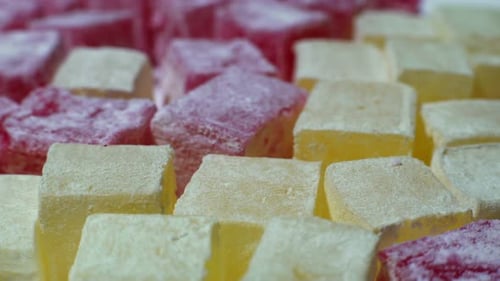 Colorful Turkish Delight Close-Up with Red and Yellow Cubes