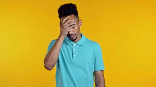 Portrait of African Man Doing Facepalm Gesture, Like No, I Forgot. Unhappy Black Guy Feeling Sorrow
