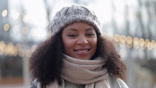 Smiling Young Woman Wearing Hat and Scarf