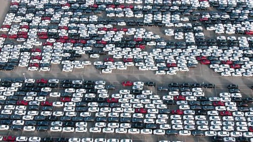 Rows of Finished Cars in Open Warehouse Aerial View
