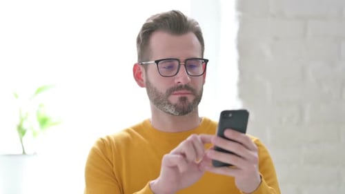 Portrait of Man Using Smartphone