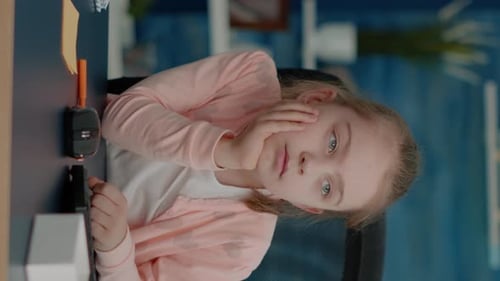 Vertical Video Tired Child Attending Online Class Lesson on Computer