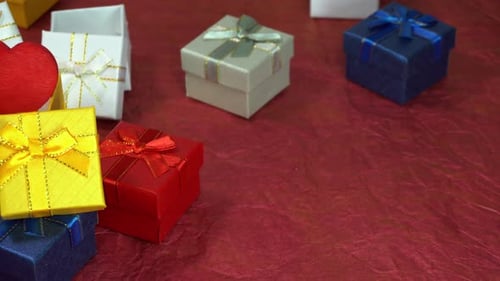 Colorful Gift Boxes with Heart on Red Background