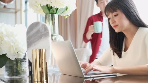Young Adults Working on Laptop at Home