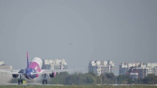 The Plane Takes Off From the Runway of the Airport