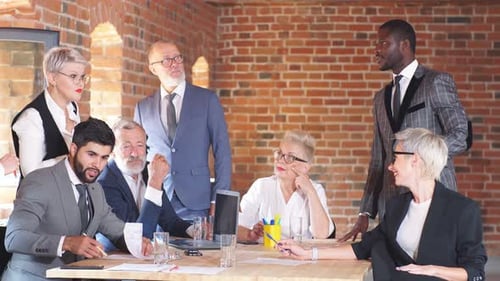 Business Team Is Discussing a Project at a Large Office Table. Creative Office Interior.