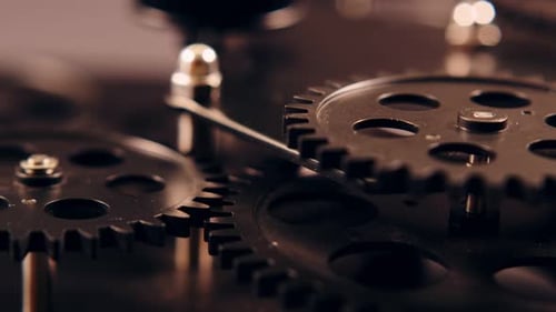 Clockwork Gears Turning in Dramatic Close Up