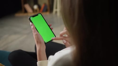 Woman Using Smartphone with Green Screen