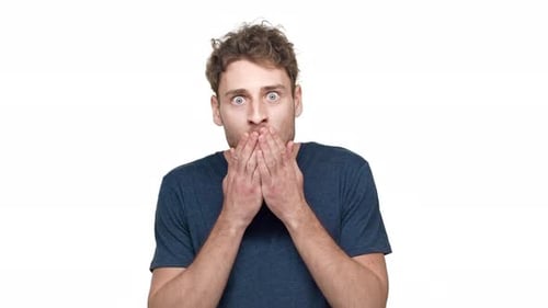 Man Reacts with Shock and Smiles