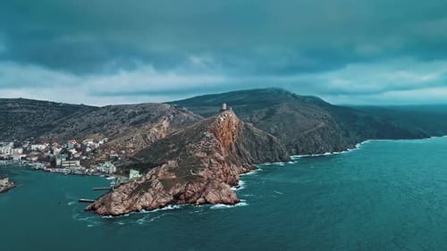 Aerial Shot of a Mountain Town on the Rocks in the Middle of the Forest with Beautiful Views of the