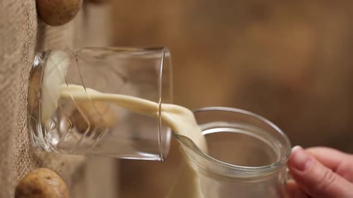 Pouring Beverage Into Glass Lying on its Side