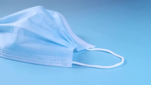 Close Up of Blue Surgical Masks on Table