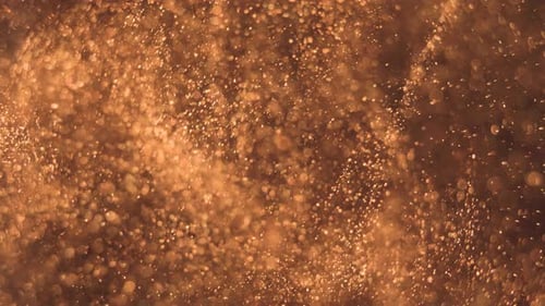 Elegant, Detailed, and Golden Particles Flow with Shallow Depth of Field Underwater