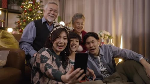 Happy Family Takes Holiday Selfie Together at Home