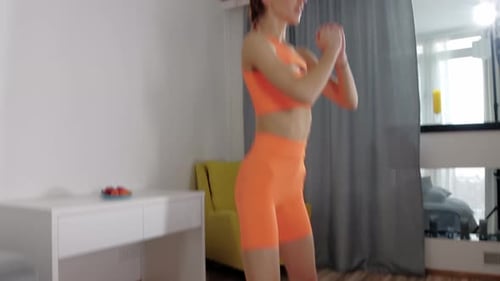 Woman Exercising, Doing Squats on Yoga Mat Indoors