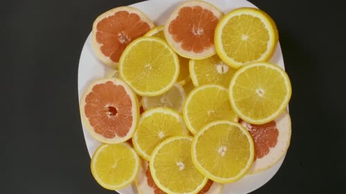 Sliced Citrus Fruit: Lemons and Grapefruit Still Life