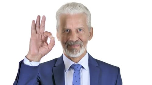 Man in Suit Gestures Approval