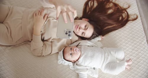 Mother and Baby Taking a Selfie Together