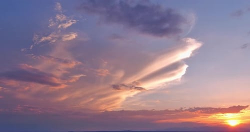 A Dramatic Orange Sunset Through the Clouds