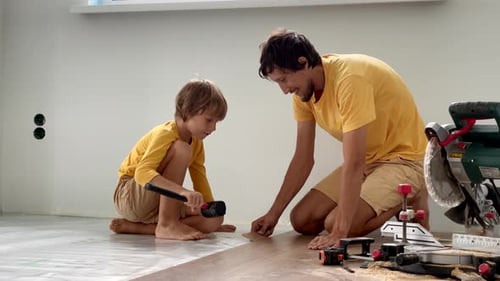Father and Son Install Wooden Floors Together