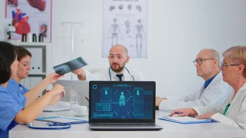 Medical Team Analyzing Data in Hospital Office