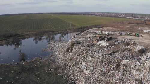 Aerial View on City Garbage Dump with Flocks of Birds