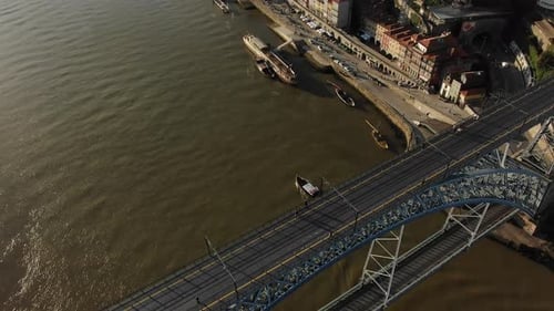 Old Metal Bridge with Distant Pedestrians Against River