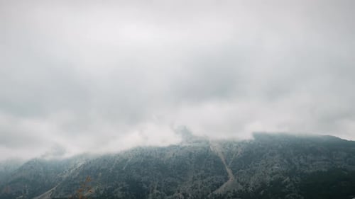 Rainy heavy clouds over mountain.
