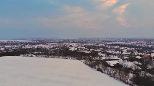 Winter mountain village landscape with snow covered houses snowy after snowfall during dusk
