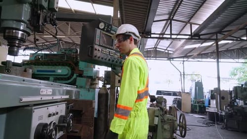 Factory Workers Handshake with Team Member in the Factory
