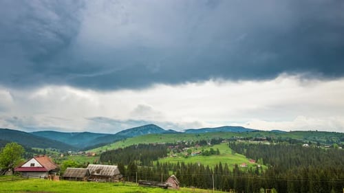Time Lapse of Blue Sky with Clouds Over Mountain